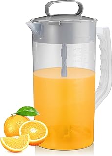 Clear plastic Pampered Chef-style pitcher with a mixing plunger, filled with juice.